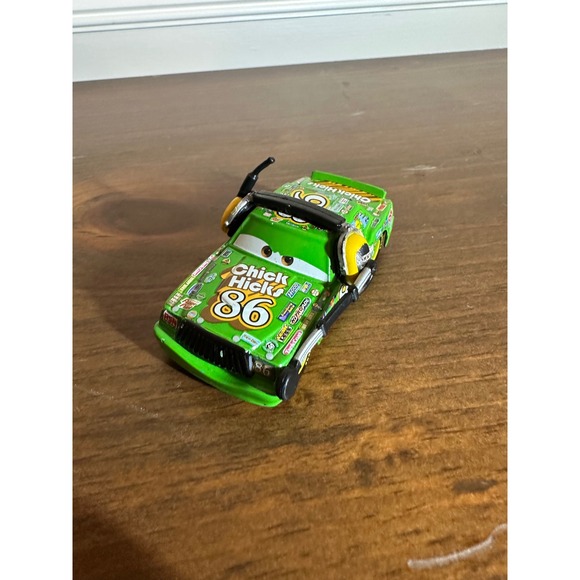 Disney Pixar Cars Chick Hicks 86 Race Car Toy Green Yellow Headphones - Picture 2 of 6